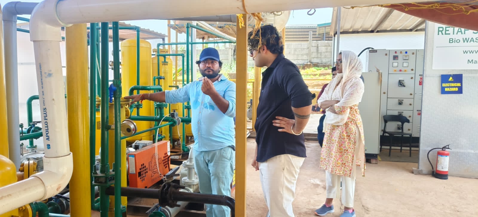 Technicians operating plant control room equipment